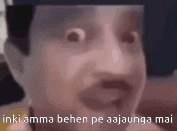 a close up of a man 's face with the words " inki amma behen pe aajaunga mai " written on it