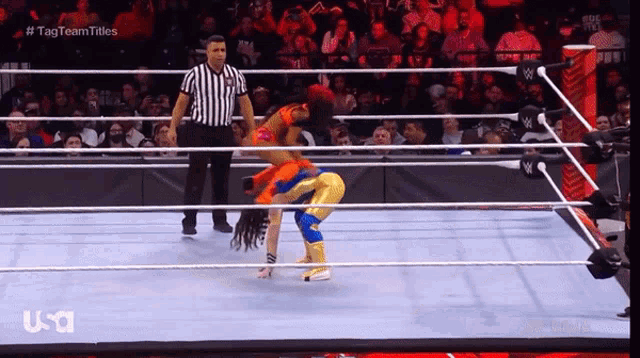 a woman in a wrestling ring with the word usa on the bottom