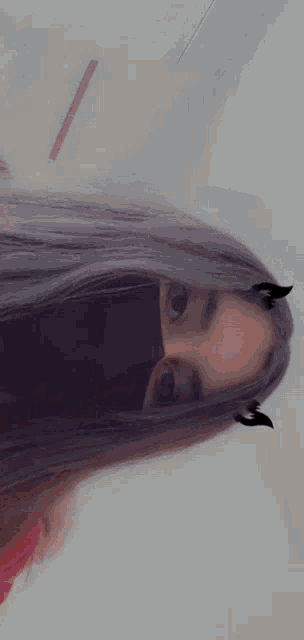 a close up of a woman 's face with a blurred background
