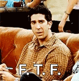 a man in a plaid shirt is sitting on a couch with the words `` f.t.f. '' written on it .
