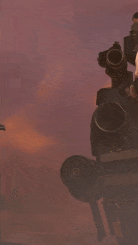 a man wearing sunglasses is holding a gun and a light
