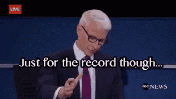 a man in a suit and tie is saying just for the record though .