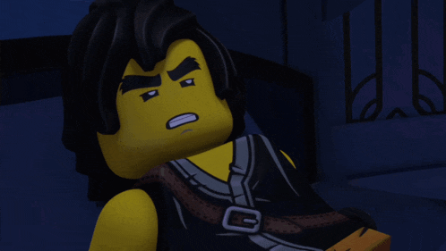 a close up of a lego figure with the letter g on the chest