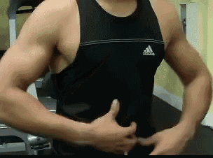 a man wearing a black adidas tank top