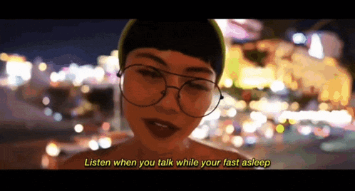 a woman wearing glasses says listen when you talk while you fast asleep