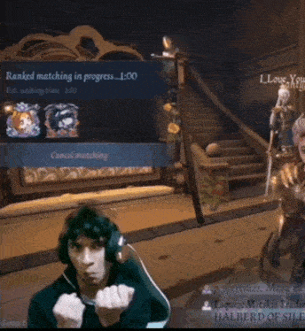 a man giving the middle finger in front of a screen that says " ranked matching in progress "