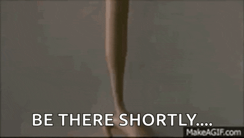 a person is holding a telephone in their hand and says `` be there shortly ... ''