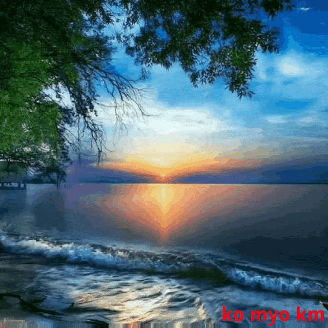 a picture of a sunset over a body of water with the words ko myo km on the bottom