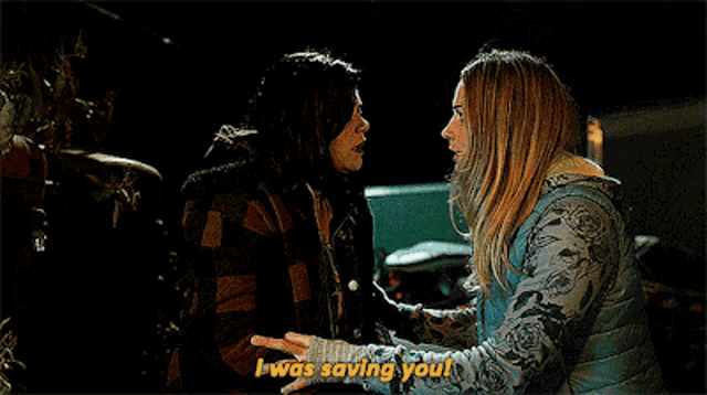 two women are standing next to each other and one of them is saying i was saving you