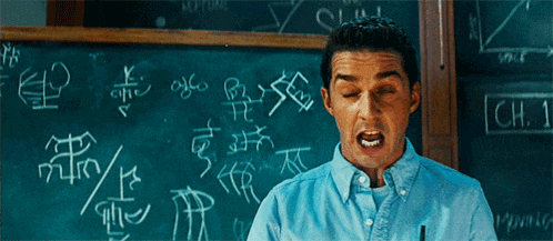 a man stands in front of a blackboard that says ch 1