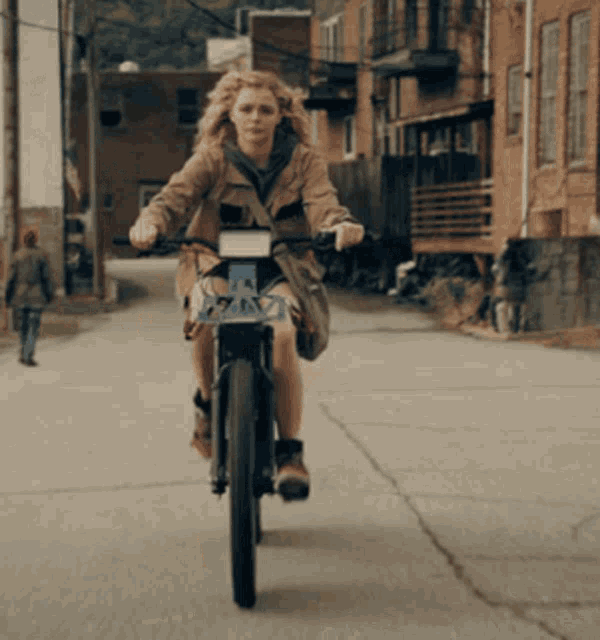 The Peripheral Chloe Grace Moretz GIF - The Peripheral Chloe Grace Moretz Bike Riding GIFs
