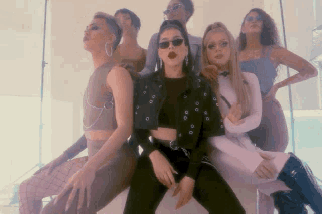 a group of women are posing for a picture together