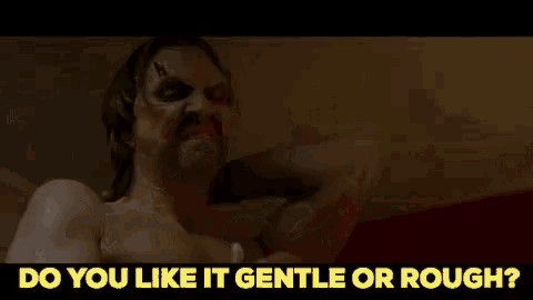 a man with a tattoo on his face is laying on a bed and asking do you like it gentle or rough ?