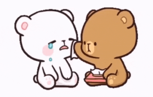 a couple of teddy bears are sitting next to each other .
