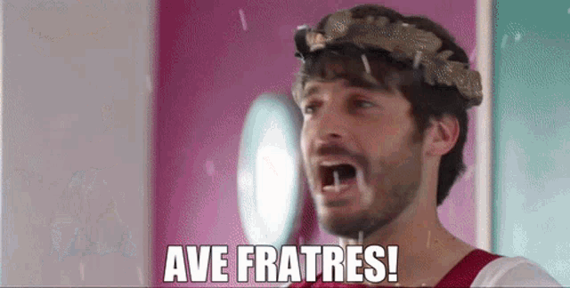 a man with a laurel wreath on his head says ave fratres !