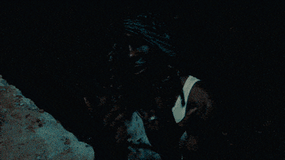 a man 's arm is visible in a dark room