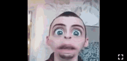 a man with a beard is making a cartoon face with his mouth open .