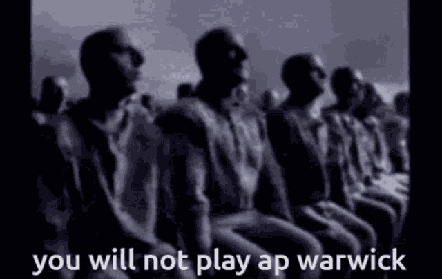 a black and white photo of a group of men sitting in a row with the caption `` you will not play ap warwick '' .