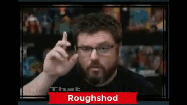 a man with glasses and a beard is making a roughshod sign