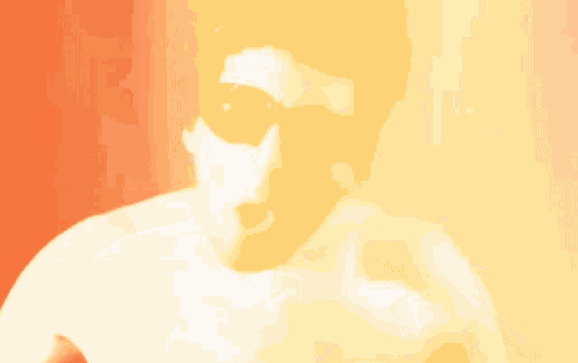 a man without a shirt is wearing sunglasses and making a face