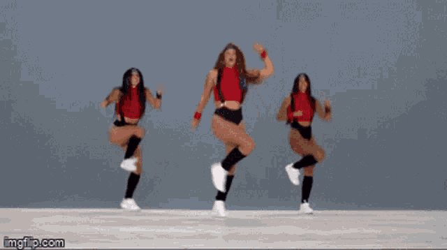 three women are dancing in a video with imgflip.com in the corner