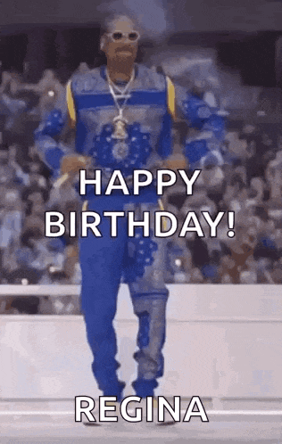 snoop dogg is dancing in front of a crowd while wearing a blue and yellow outfit .