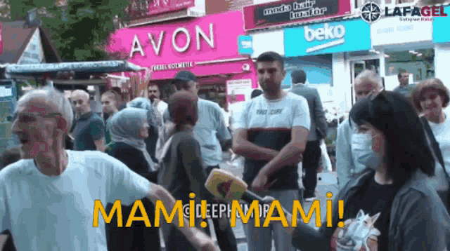 a group of people are standing in front of a store that says avon