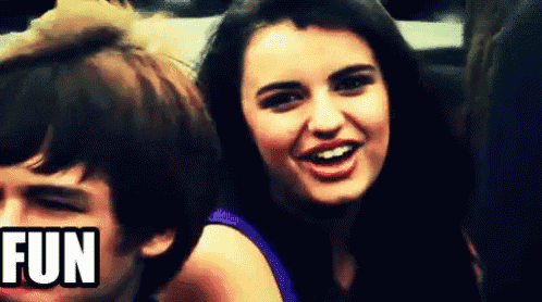 a girl is smiling next to a boy with the word fun in the upper right corner