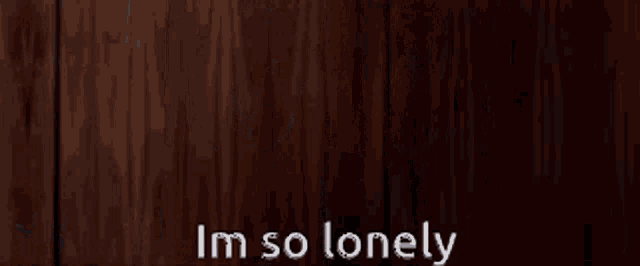 a man in a suit and tie is saying i 'm so lonely
