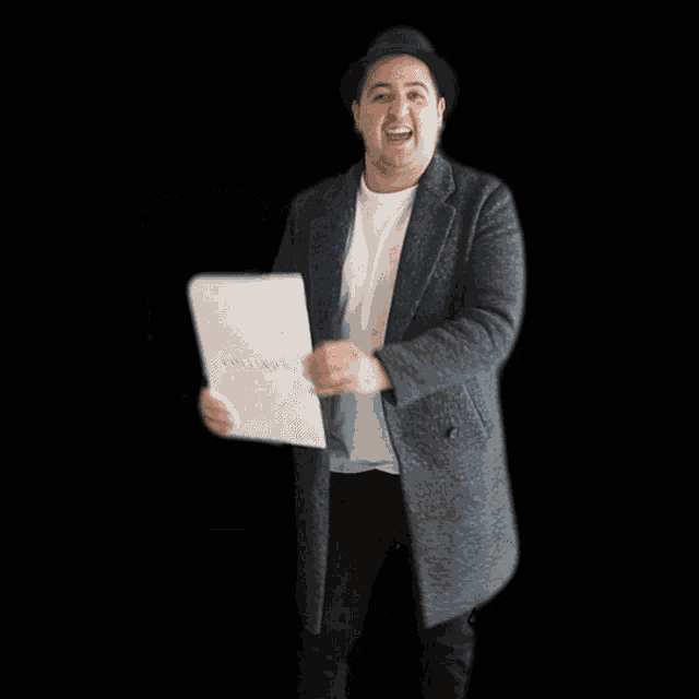 a man in a hat is holding a white box with the words done deal in blue letters