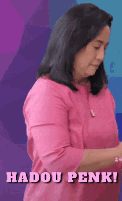a woman in a pink shirt with the words hadou penk written above her
