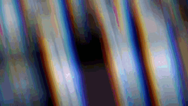 a computer generated image of a rainbow colored striped background