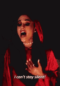 ariana grande is wearing a red cape with a hood and says `` i can 't stay silent ! ''