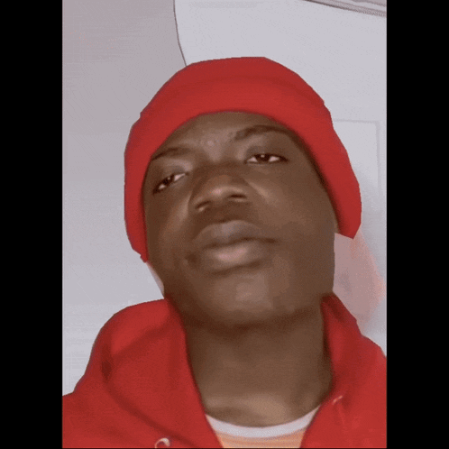 a man wearing a red hat and a red sweatshirt