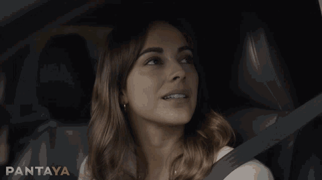 a woman sits in a car with her eyes closed and the word pantaya is on the bottom right