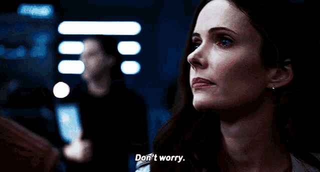 a woman says don 't worry in a dark room