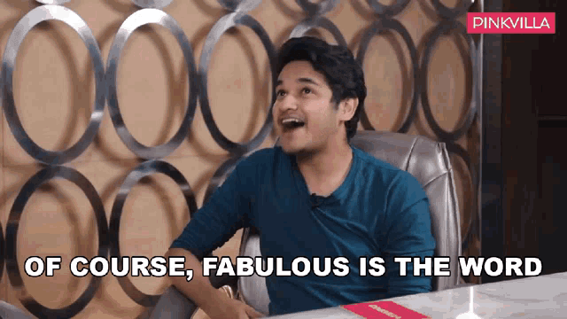 a man is sitting at a table with the words of course fabulous is the word