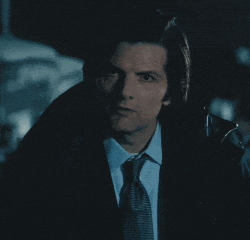 a man in a suit and tie with the words are you fucking kid
