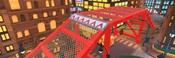 a red bridge is in the middle of a city .