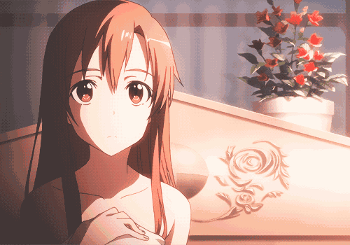 a girl with long brown hair is standing in front of a flower pot