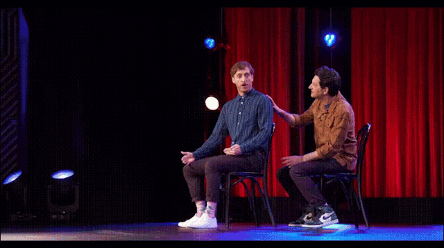 two men on stage with one saying i 'm loose shouting