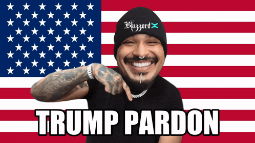a man in front of an american flag with the words trump pardon