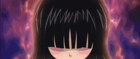 a close up of a girl 's face with long black hair and a piercing in her belly .
