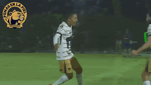 two pumas en la piel soccer players hugging each other on the field