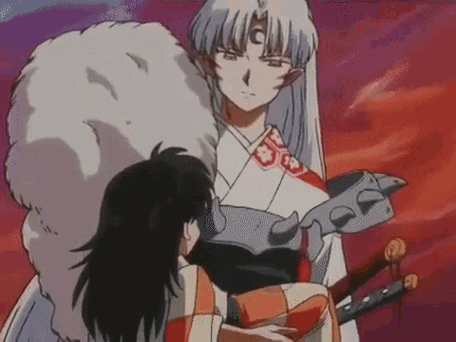 a man and a woman are standing next to each other in a cartoon . the man is holding a sword .