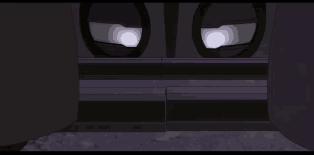 a dark room with a few windows and a light coming out of them