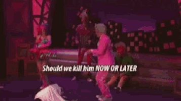 a woman is laying on a bed with the words `` should we kill him now or later '' written on the bottom .