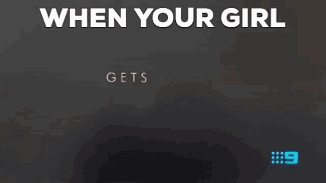 a man in a suit and tie is standing in front of a screen that says when your girl