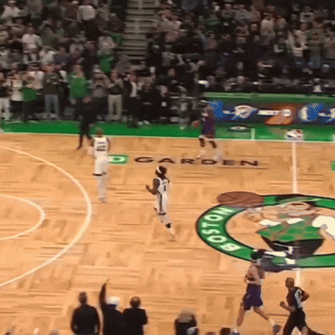 a basketball game is being played on a court that says boston