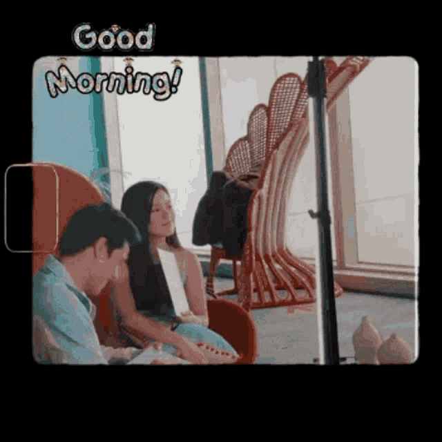 a man and a woman are sitting next to each other in a room with the words good morning written above them